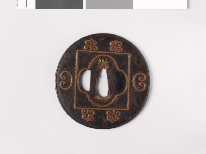 Lenticular tsuba with mokkō shape and C-scrollsfront