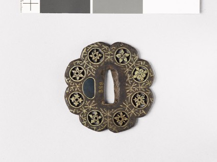 Lobed tsuba with plants including water-weedsfront