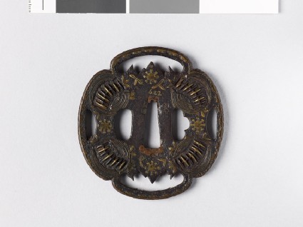 Mokkō-shaped tsuba with star and leaf formsfront