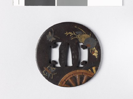 Tsuba with plants, butterflies, and chariot-wheelsfront