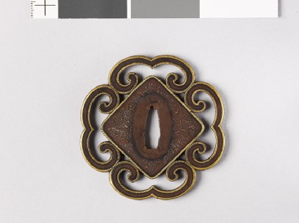 Tsuba with roped edges and heraldic devicesfront
