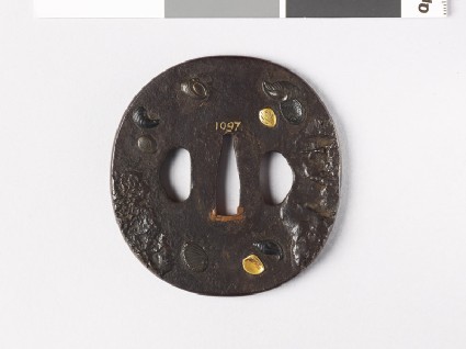 Tsuba with marine molluscs amid mud banks or rocksfront