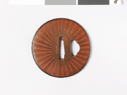 Lenticular tsuba with Amida-yasurime, or radial striationsfront