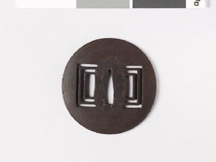Tsuba with raised edge and oblong piercingsfront