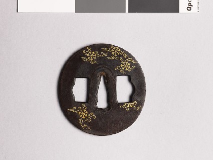 Tsuba with flowers and scrollsfront