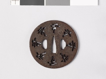 Tsuba with characters and flowersfront