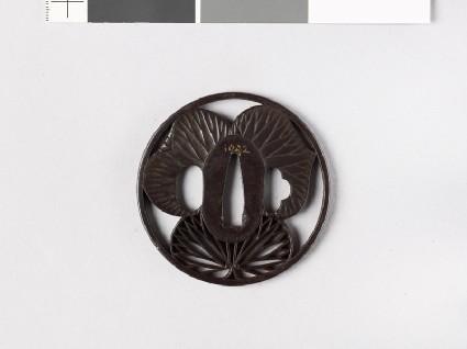 Round tsuba with three heraldic aoi, or hollyhock leavesfront
