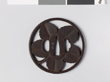 Round tsuba with paper mulberry leaffront