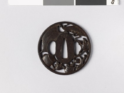 Round tsuba with takaramono, or precious thingsfront