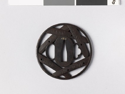 Round tsuba with five nakago, or sword tangsfront