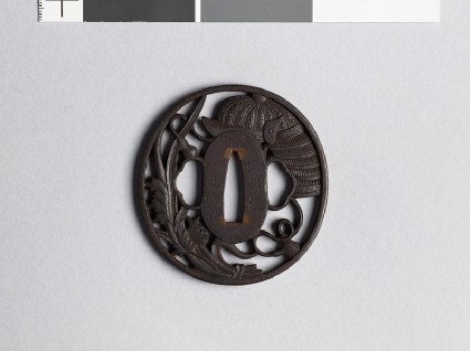 Tsuba with helmet and leavesfront