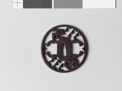 Tsuba with mon of swastika and hawk feathersfront