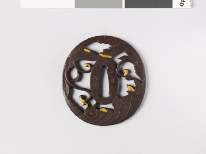 Tsuba with phoenix formed from leaves and scrollsfront