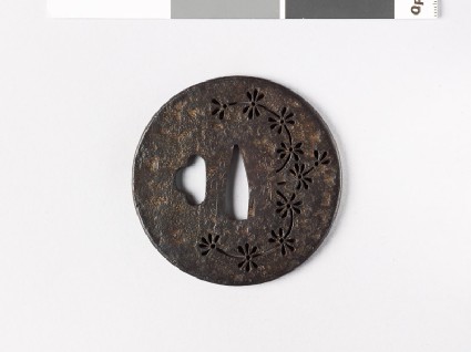 Round tsuba with water plantfront