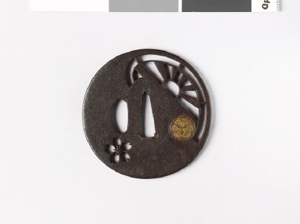 Round tsuba with mon formed from cissus leavesfront