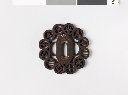 Lobed tsuba with 12 different monfront
