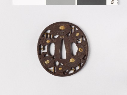 Tsuba with chrysanthemum growing over a trellisfront