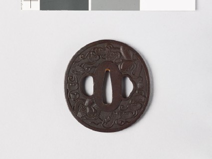 Tsuba with noble's headgear and mon formed from aoi, or hollyhock leavesfront