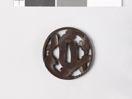 Tsuba with a riding crop and two ends of a saddlefront