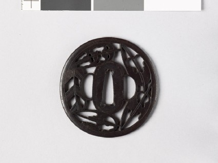 Tsuba with heraldic hawk feathers and ground bamboofront