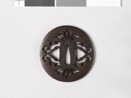 Lenticular tsuba with stylized flowersfront