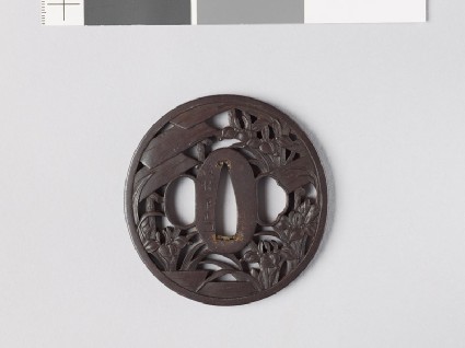 Tsuba with iris plants and bridges in a swampfront