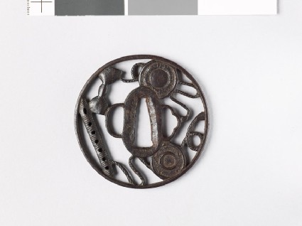 Round tsuba with six-holed flute and parts of a hand drumfront