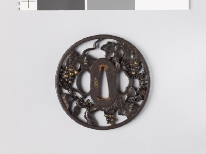 Round tsuba in the form of a grape vinefront