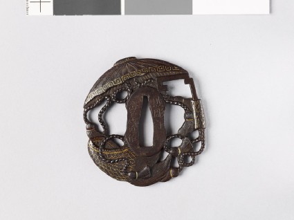 Tsuba in the form of takaramono, or precious things, including the hat and cloak of invisibility and the storehouse keyfront