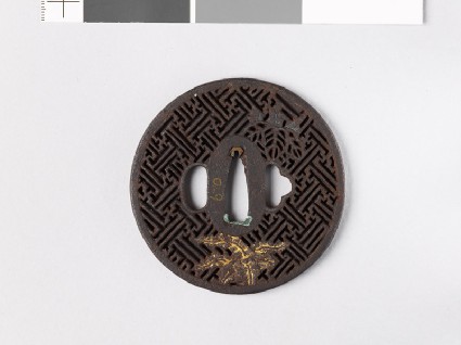 Round tsuba with rinzu, or swastika-fret diaper, and mon made from kiri, or paulownia leavesfront