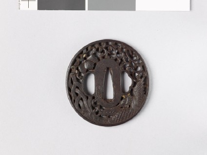 Tsuba with phoenix, flowers, and mon made from kiri, or paulownia leavesfront
