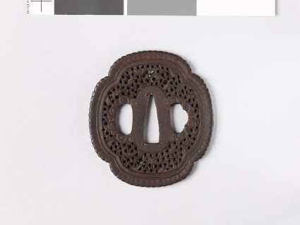 Mokkō-shaped tsuba with scrollwork and fishfront