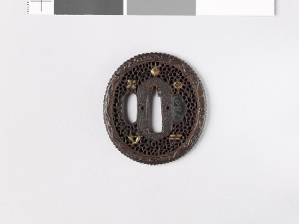 Tsuba with dragons and five Precious Objects amid scrollworkfront