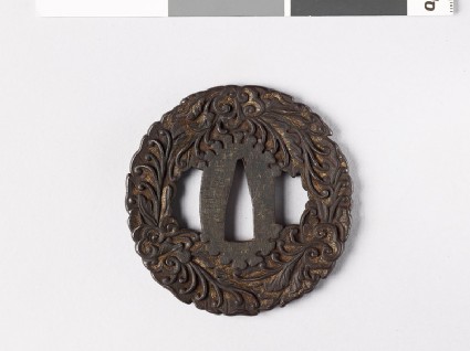 Tsuba with leaves and branching tendrilsfront