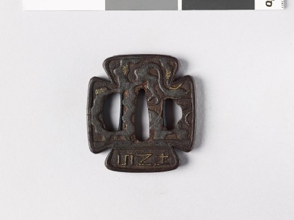 Tsuba with dragons and Roman-style letteringfront