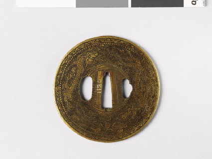 Round tsuba with dragons and Precious Objectsfront