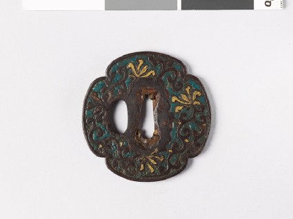 Mokkō-shaped tsuba with Indian lotuses and radial striationsfront