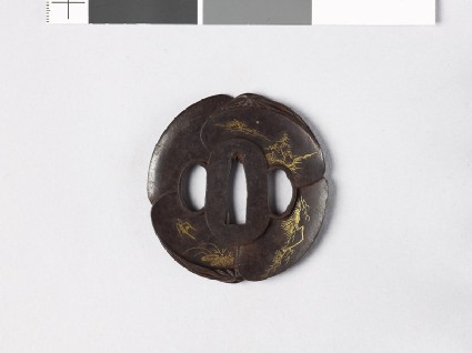 Tsuba in the form of overlapping clam shells, each depicting a bird or animalfront