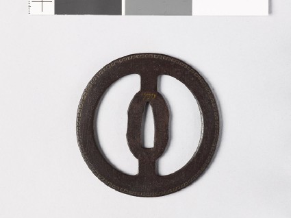 Round tsuba with fret patternsfront