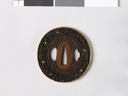 Tsuba with scrolls and fūchō, or birds or paradisefront
