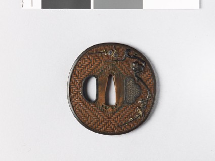 Tsuba with owl perched on a plum branchfront