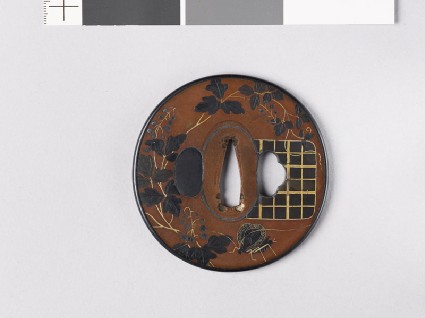 Tsuba with flowering vine and butterflyfront