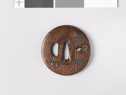 Lenticular tsuba with bamboo stems and tigersfront
