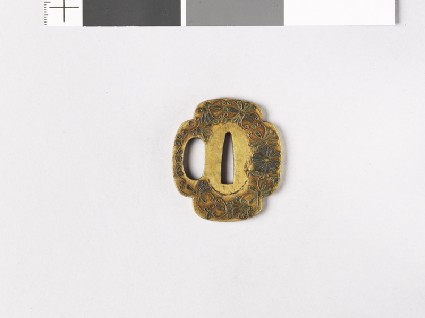 Tsuba with kiku-karakusa, or floral scrollsfront