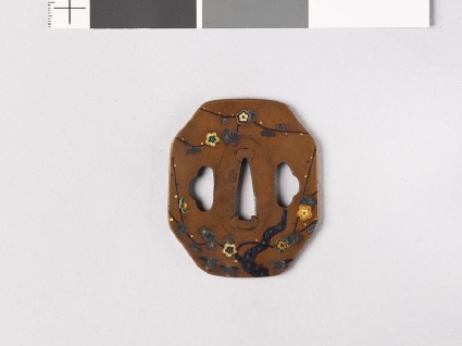 Octagonal tsuba with plum tree and ground bamboofront