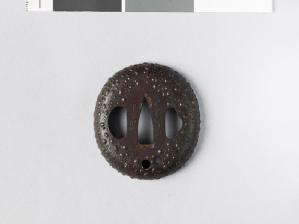 Tsuba with gama-hada, or toad skin, surfacefront