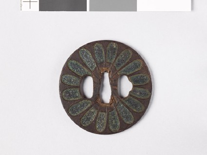 Tsuba with chrysanthemoid florets and sword-bladesfront
