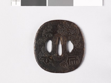 Tsuba with Genjimon and mon made from kiri, or paulownia leavesfront