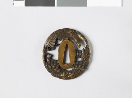 Tsuba with hawk flying above a plum treefront
