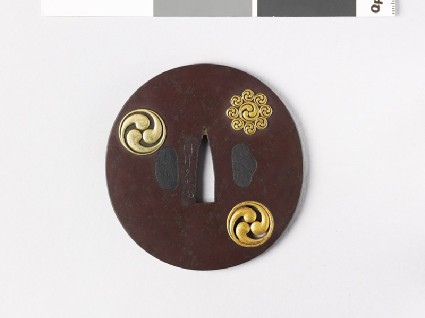 Tsuba with mitsudomoye and mitsudomoye-kuyō monfront